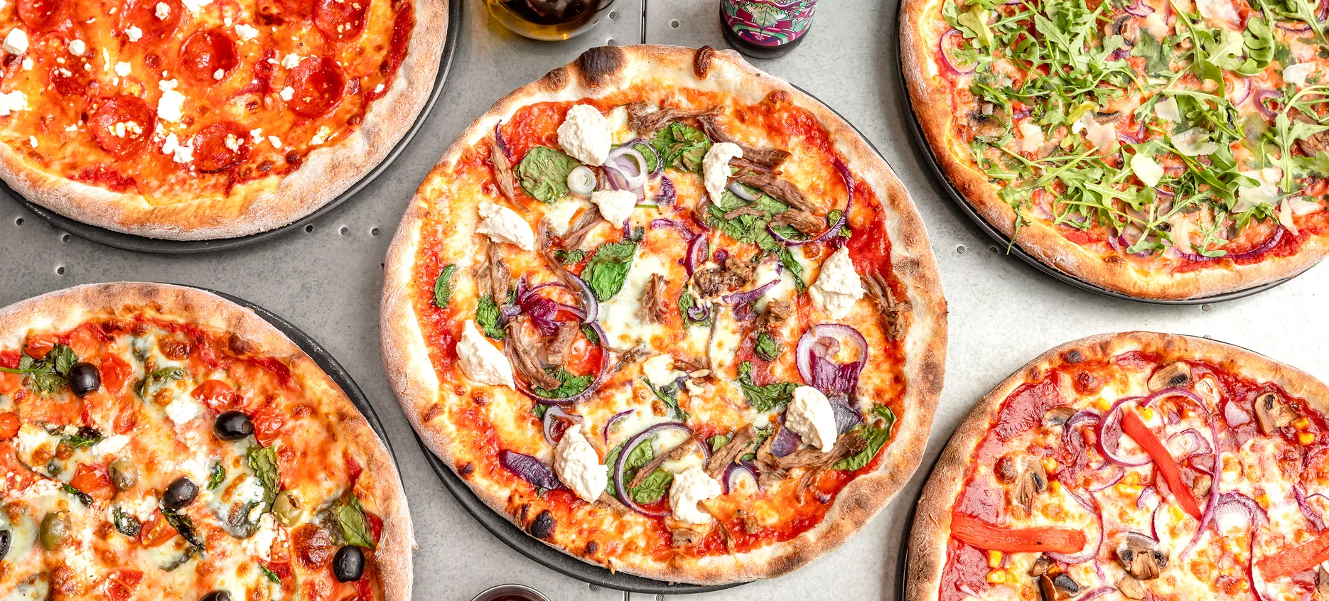 A table of freshly baked @homepizza pizzas.