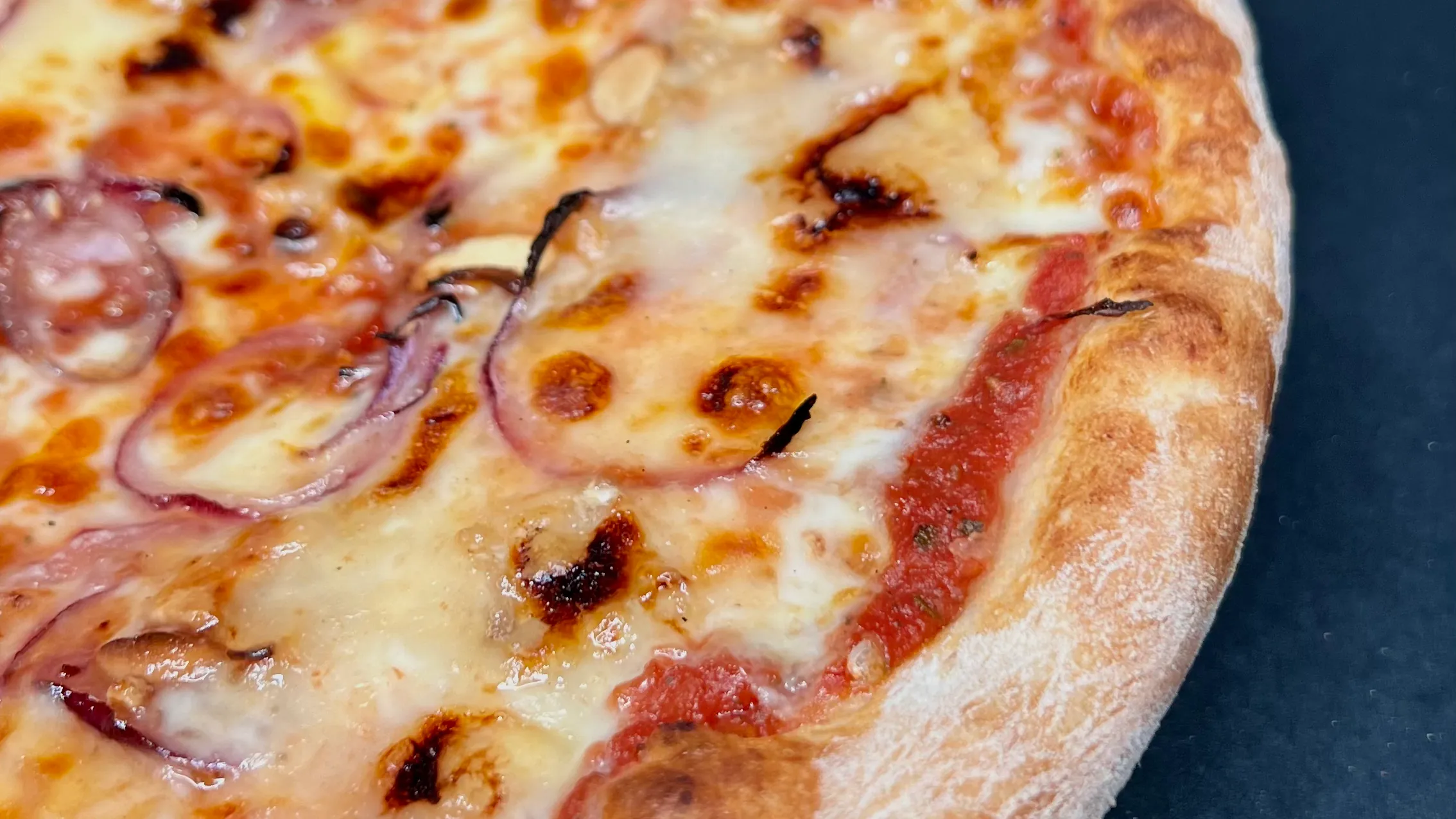 A golden, bubbling @homepizza crust.