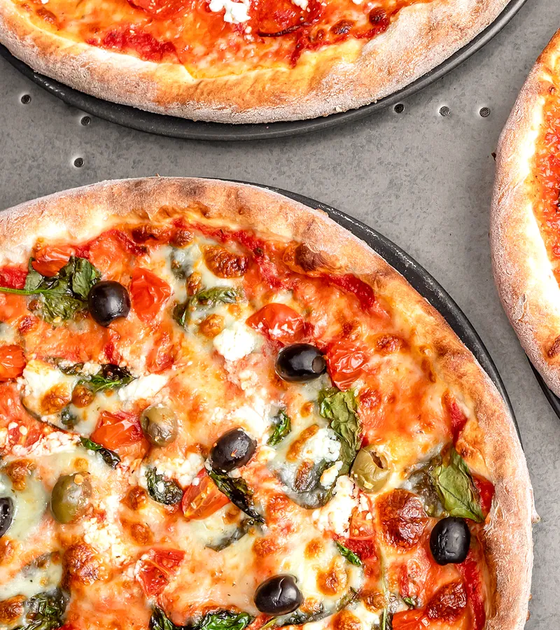 Olive, roasted tomato and basil pizza.