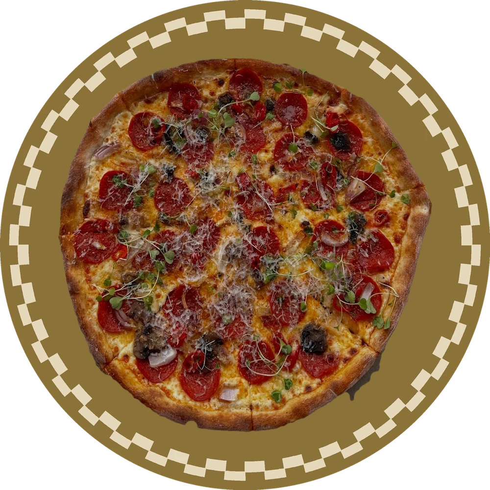 An @homepizza pizza on a gold serving plate.