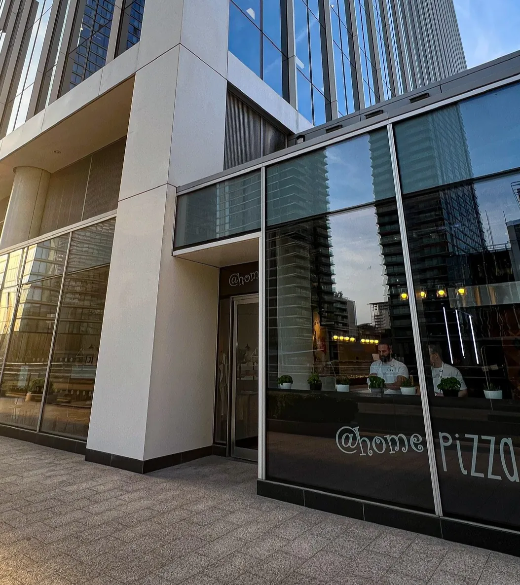 The glass-fronted @homepizza restaurant on Bank Street, Canary Wharf.